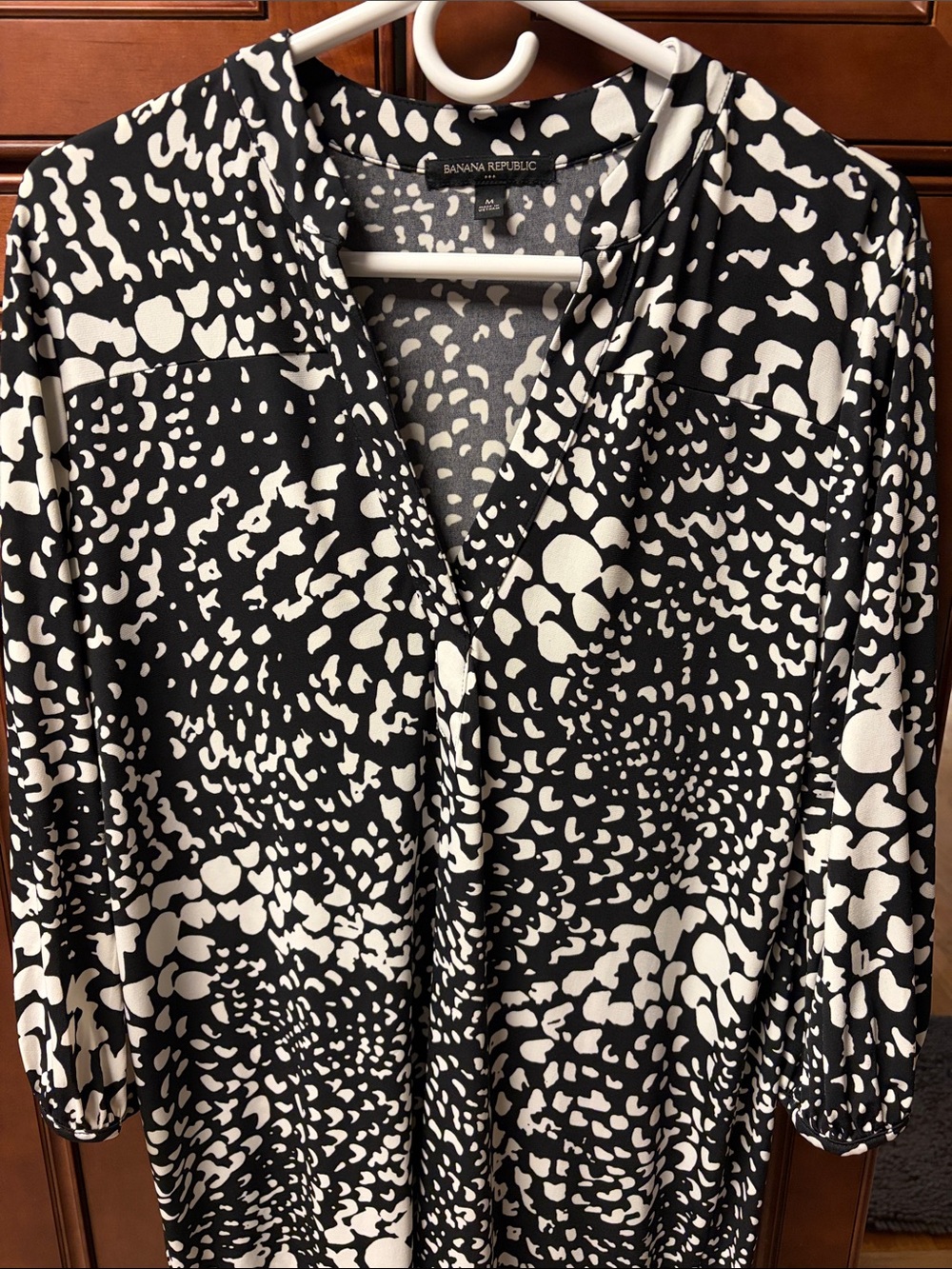 3/4 sleeves banana republic black-and-white dress with split hem on each side.